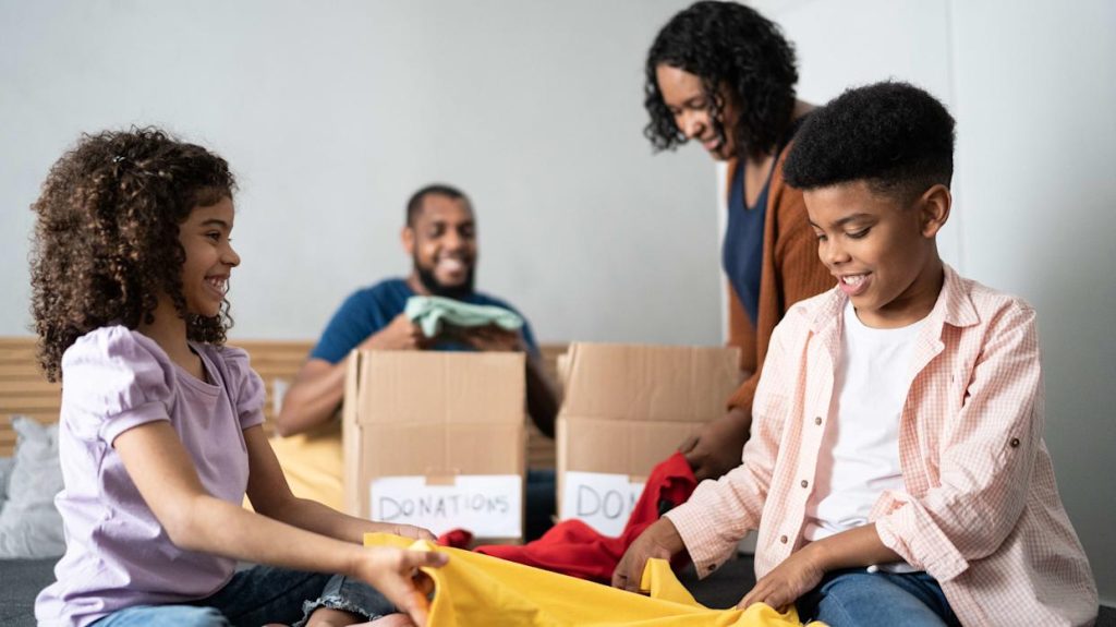 Person decluttering and sorting items before packing